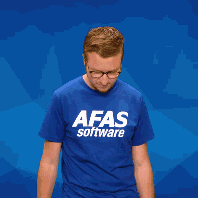 a man wearing a blue afas software t-shirt