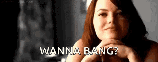 a woman is smiling with her hands folded and the words `` wanna bang '' written above her .