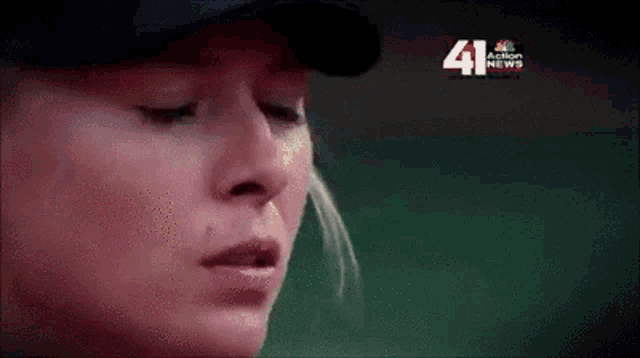 a close up of a woman 's face with the number 41 on the bottom left