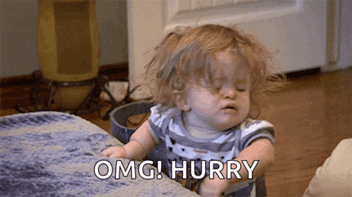 a baby girl is sitting on a couch and making a funny face and saying omg ! hurry .