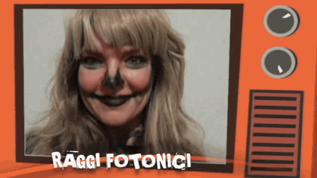a picture of a woman with black paint on her face and the words ragg fotonici
