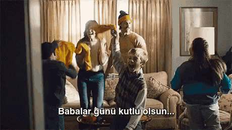 a group of people are dancing in a living room with the words babalar gunu kutlu olsun