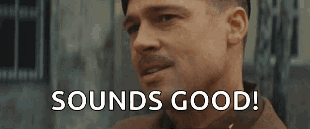 a man with a mustache is smiling and says `` sounds good '' .