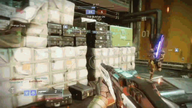 a video game is being played in a room with a stack of luggage and boxes