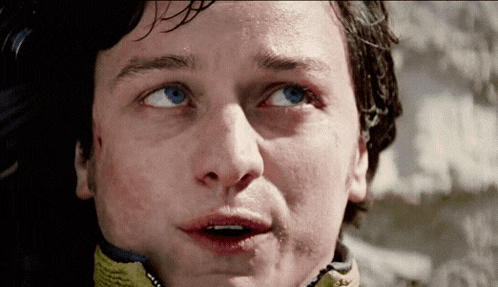a close up of a man with blue eyes