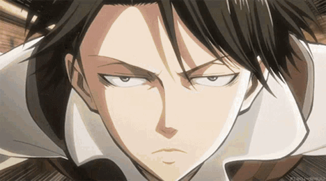 a close up of a man 's face with a serious look on his face .