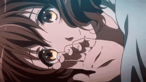 a close up of a person 's face with a hand on their nose