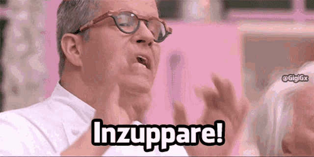 a man wearing glasses is making a funny face and says inzuppare !