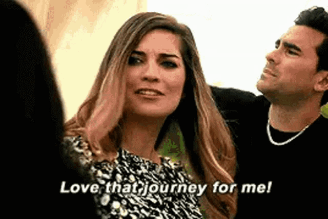 a man and a woman are standing next to each other and the woman is saying `` love that journey for me ! ''