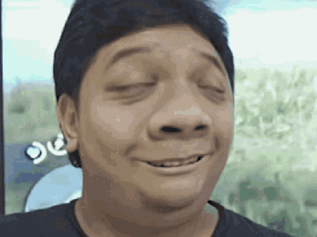 a close up of a man making a funny face