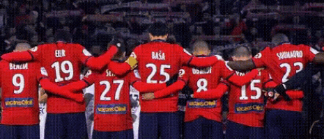 a group of soccer players wearing red jerseys with the numbers 9 9 9 9 9 9 9 9 9 9 9 9 9 9 9 9