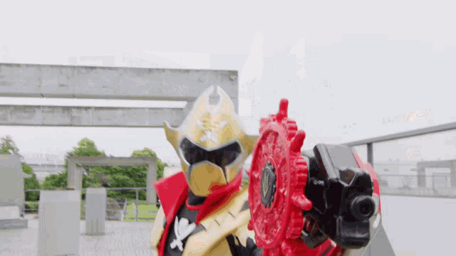 a man in a pirate costume is pointing a gun