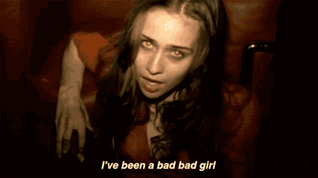 a woman sitting in a chair with the words i 've been a bad bad girl below her