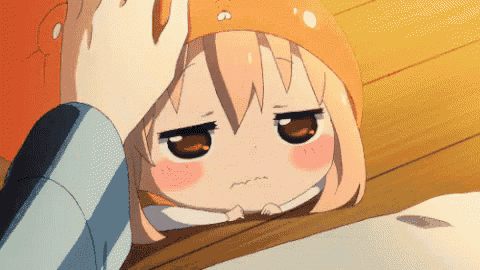 a girl with a hat on her head is laying down