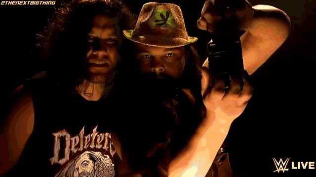 a man in a hawaiian hat is holding a flashlight in front of another man