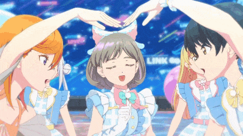 a group of anime girls making a heart with their hands in front of a sign that says link
