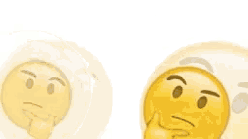 a couple of smiley faces with their hands on their faces .