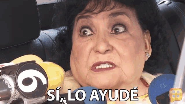a woman is sitting in a car with a sign that says 6