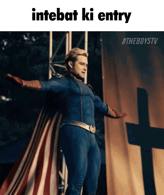 a man in a superhero costume is standing in front of a cross with the words intebat ki entry above him
