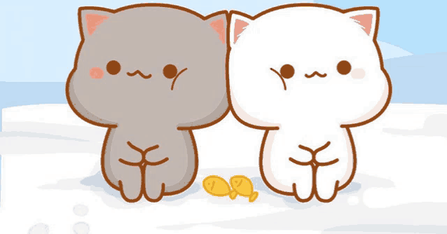 two cartoon cats are sitting next to each other on a snowy beach .