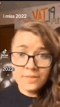 a woman wearing glasses is making a funny face and says i miss 2022