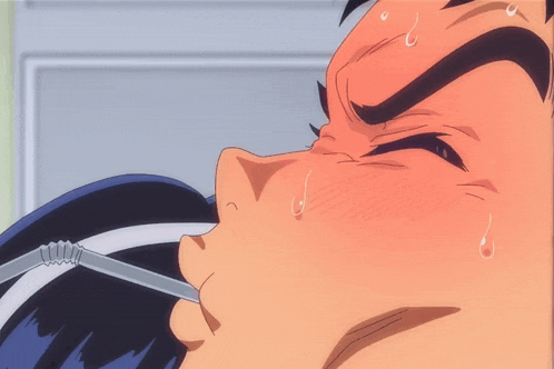a close up of a person 's face with sweat coming out of their mouth