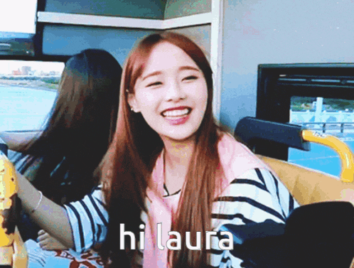 a girl is smiling and says hi laura
