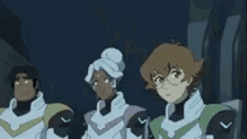 a cartoon character is making a funny face while standing in front of a group of people .