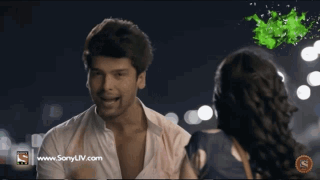 a man and woman are looking at each other on a screen that says sony liv