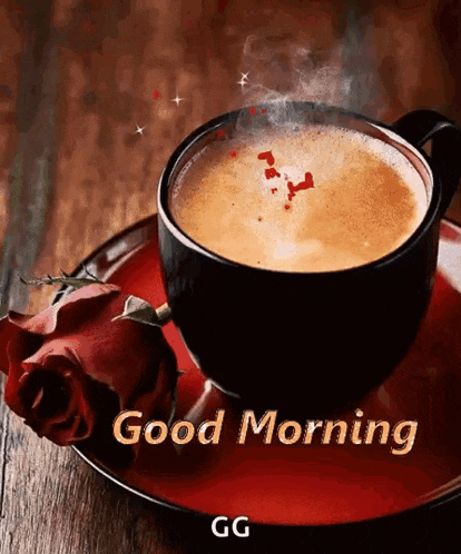 a cup of coffee on a saucer with a rose and the words `` good morning '' .