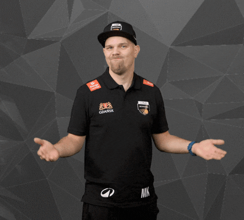 a man wearing a polo shirt that says gdansk