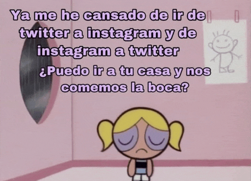 bubbles from the powerpuff girls sits in front of a wall with a drawing of a boy on it