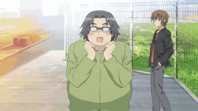 a man with glasses is standing next to a man in a suit