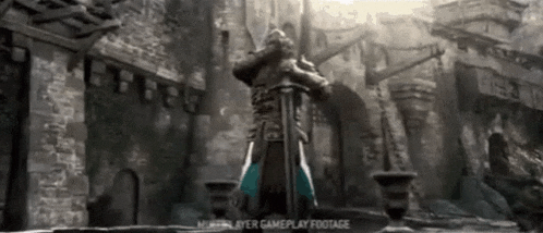 a man with a sword is standing in front of a castle .