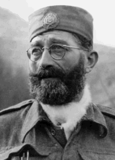 a man with a beard and glasses is wearing a hat that says ' u.s.s. ' on it