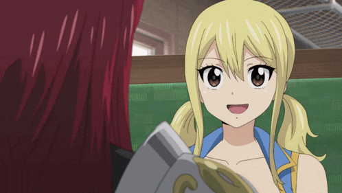 a girl with blonde hair is smiling and holding a book