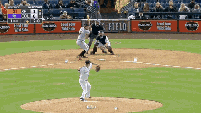 a baseball game is being played in a stadium with advertisements for jack links