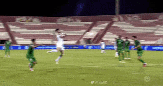 a soccer game is being played in a stadium with a twitter logo in the corner
