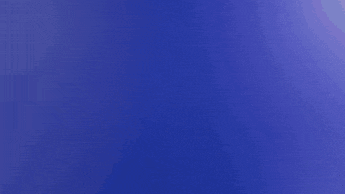 a close up of a toothbrush against a purple background