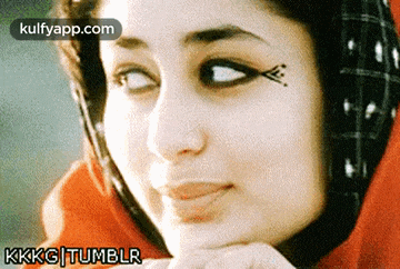 a close up of a woman 's face with a kkkg tumblr watermark