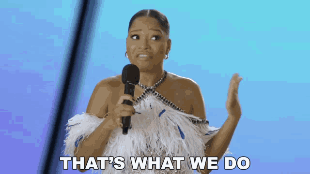 a woman holding a microphone with the words that 's what we do below her