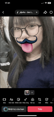 a girl with glasses and a mustache on her face is on a phone screen at 17:41