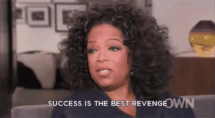 a woman with curly hair is sitting on a couch with the words success is the best revenge written below her