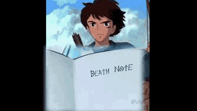 a boy is holding a book titled death note .