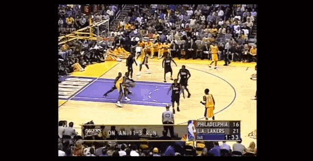 a philadelphia lakers basketball game is being played on a sunny day