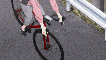 a person is riding a bike on a road