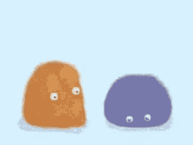 two stuffed animals , one orange and one blue , are standing next to each other on a blue background .