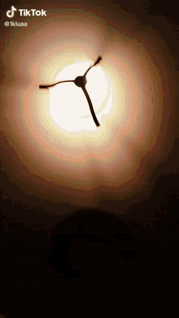 a tiktok video of a light being turned on with a stick in the middle