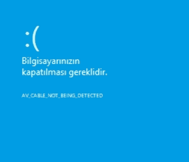 a blue screen with a smiley face and the words " av cable not being detected "