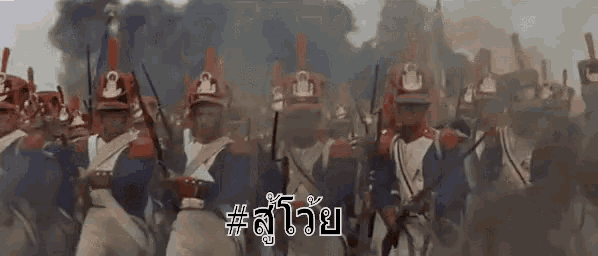 a large group of soldiers are marching in a line with smoke coming out of their helmets and guns .